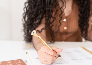 Woman writing her business plan