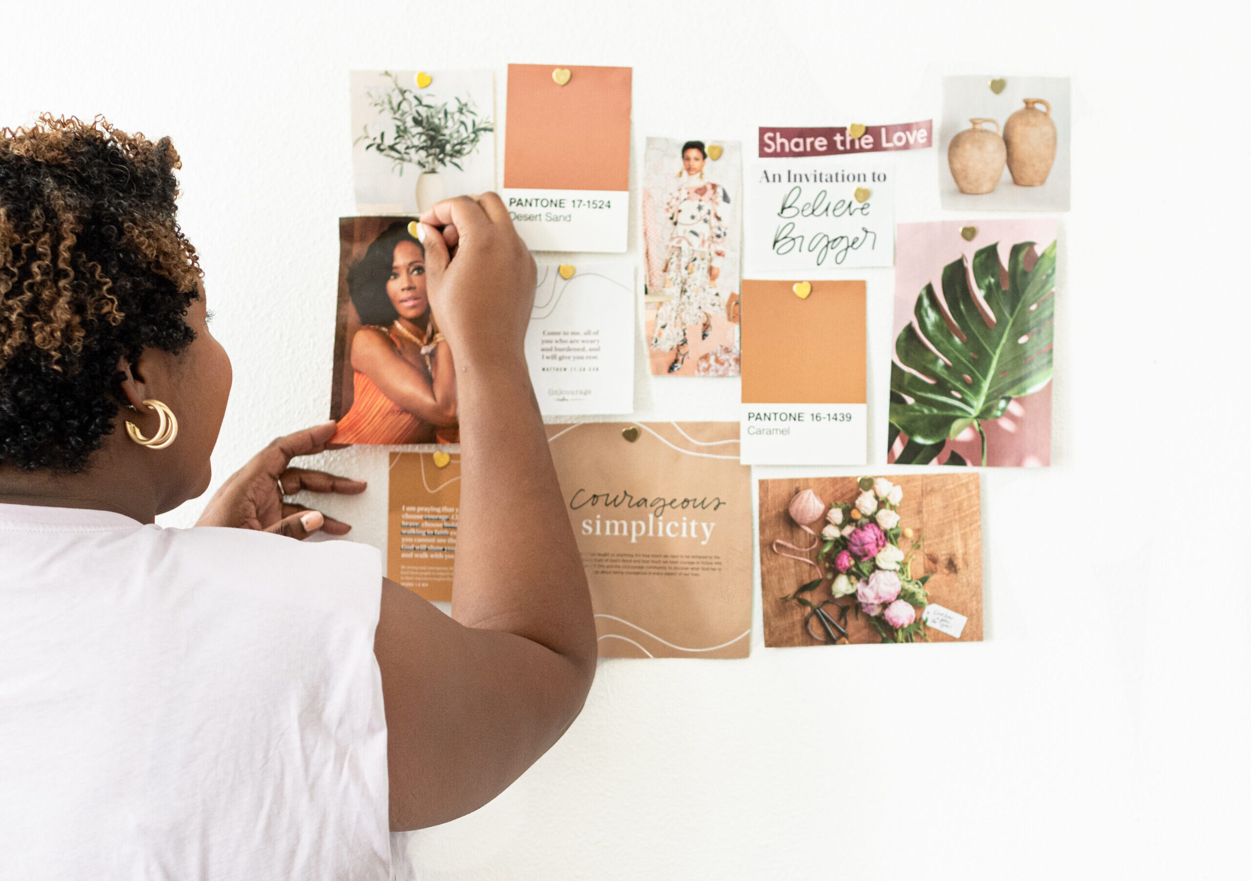 Woman putting up mood boards
