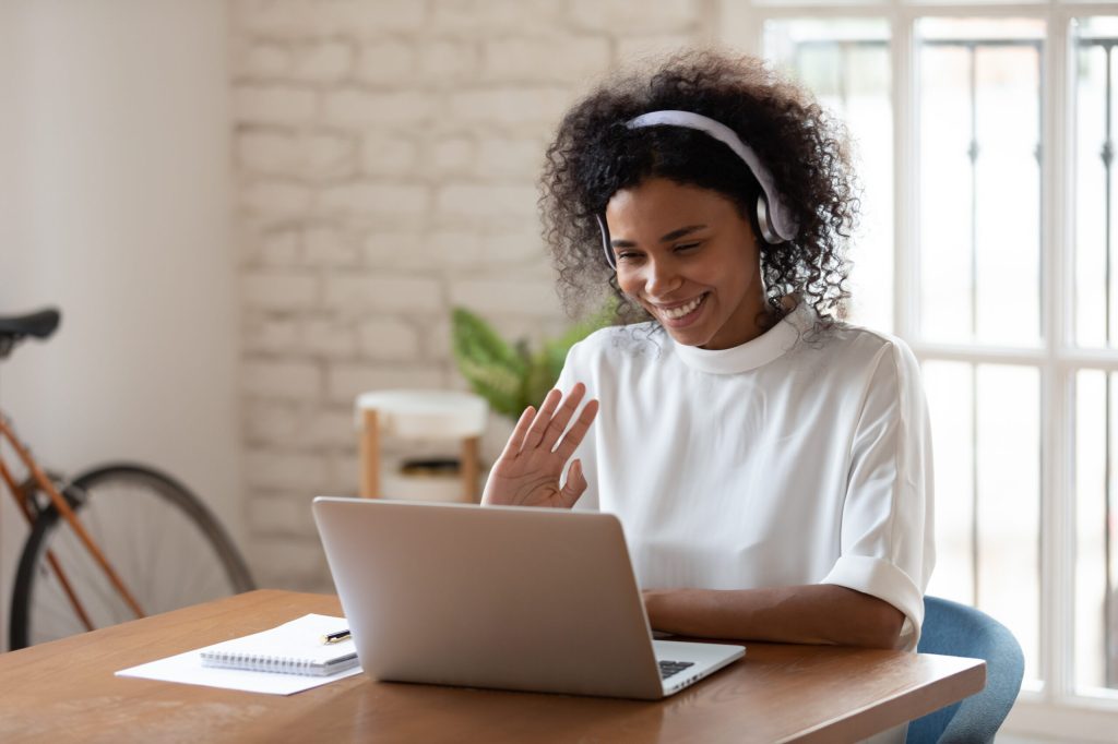 Woman in customer service chatting online with client