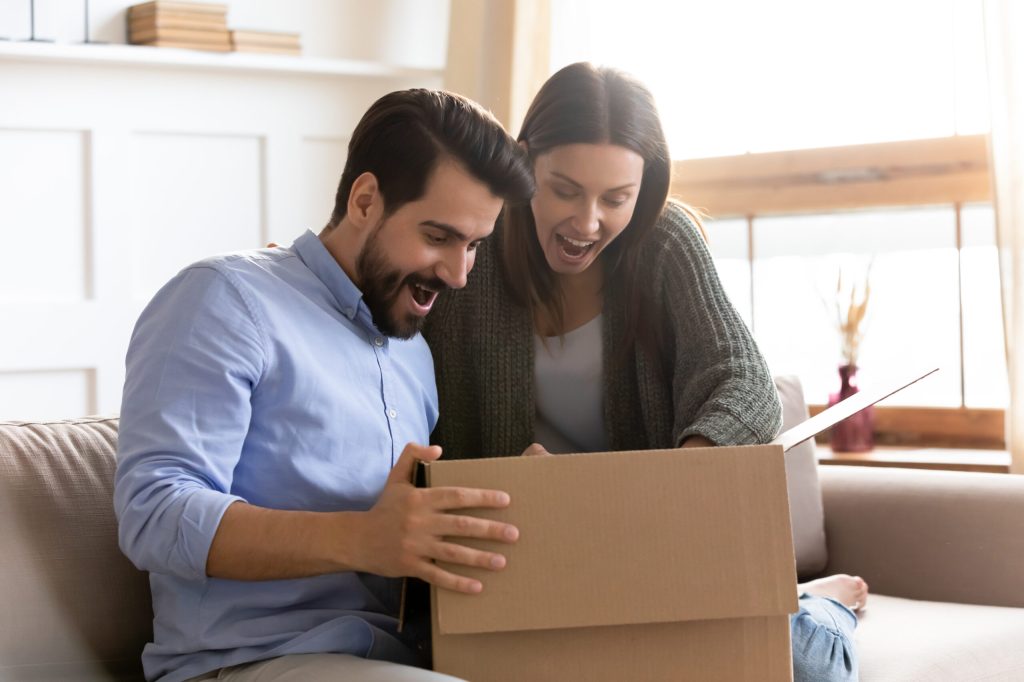 couple receiving gift - surprise and delight marketing