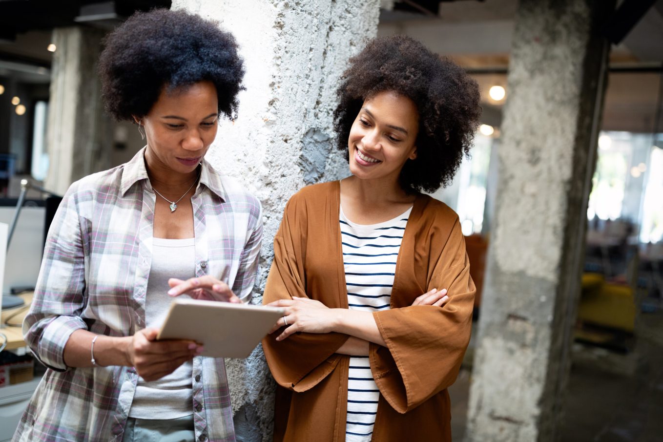Woman referring a wedding business through word of mouth to friend