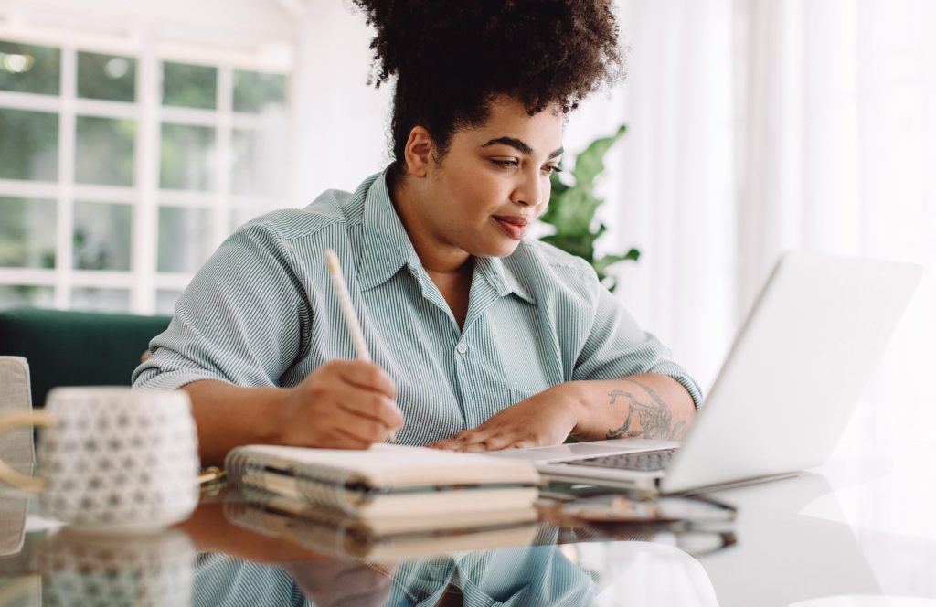 woman on laptop working on content strategy