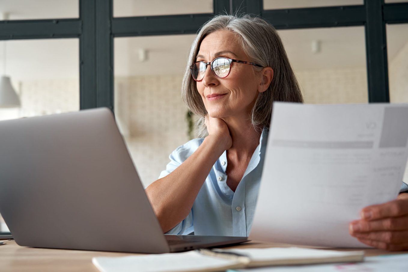 woman on laptop working on her media kit