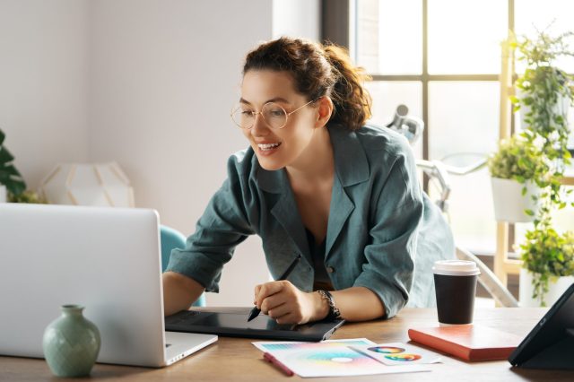 woman on laptop planning for beginning of the year business