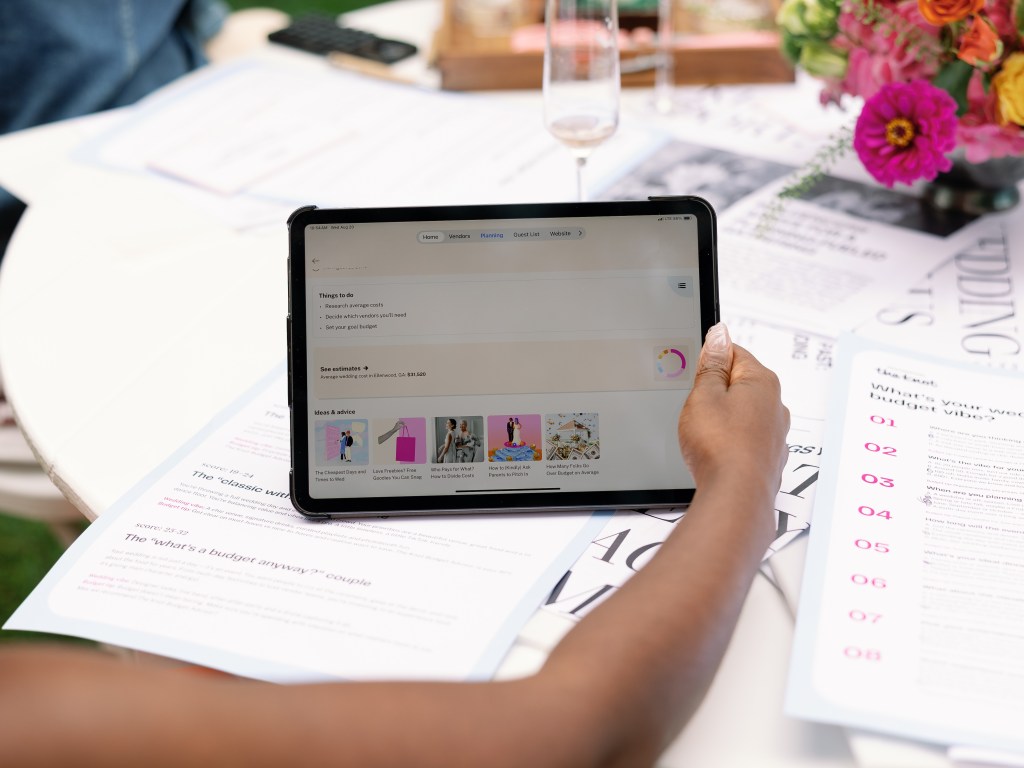 One arm around a tablet with web page loaded