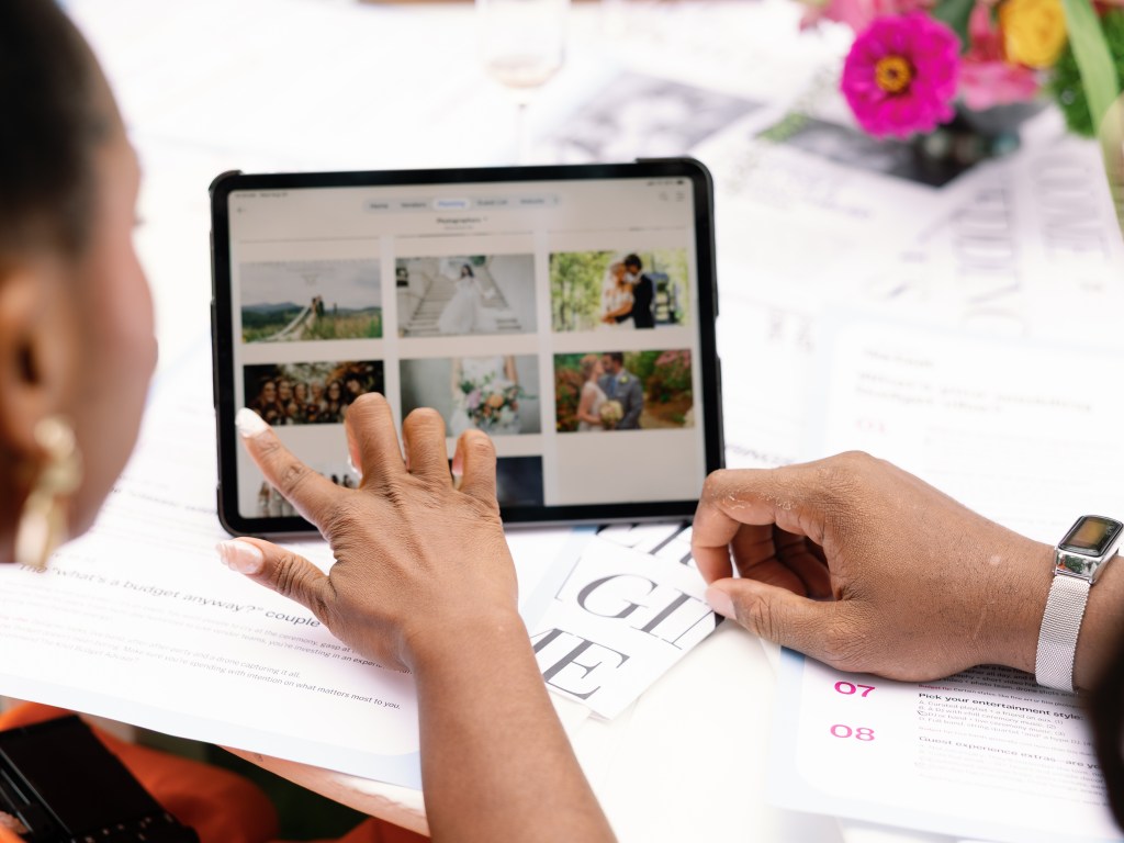 Women pointing at a photo gallery on Ipad