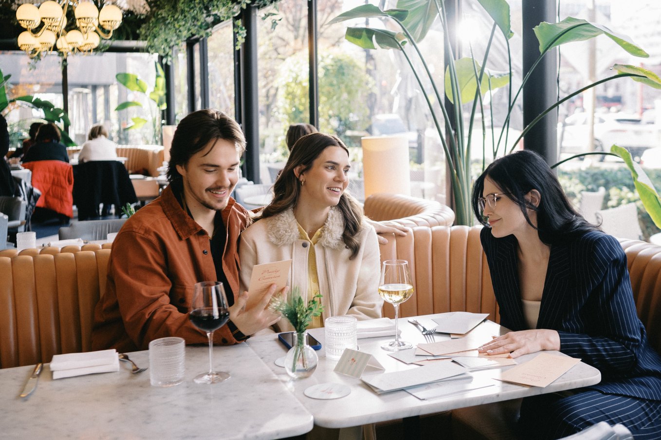 Wedding vendor with couple at restaurant
