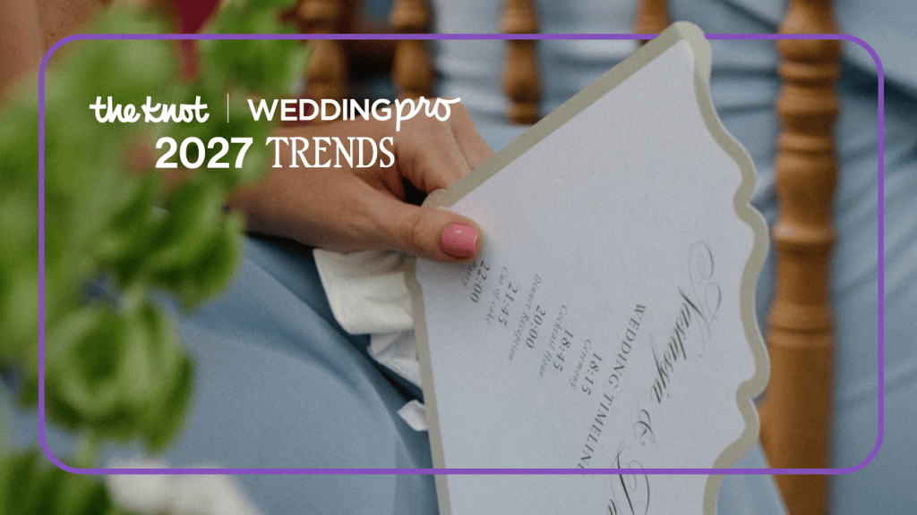 Wedding guest holding wedding invitation